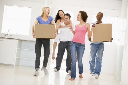 Professional flat removals planning in Hampstead with moving boxes and furniture