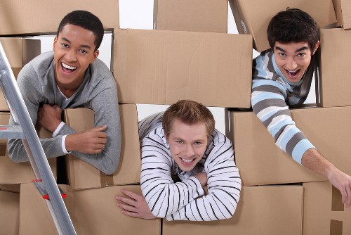 Student packing items for safe storage during a term break