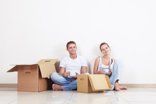 Removal professionals loading furniture carefully in Hampstead
